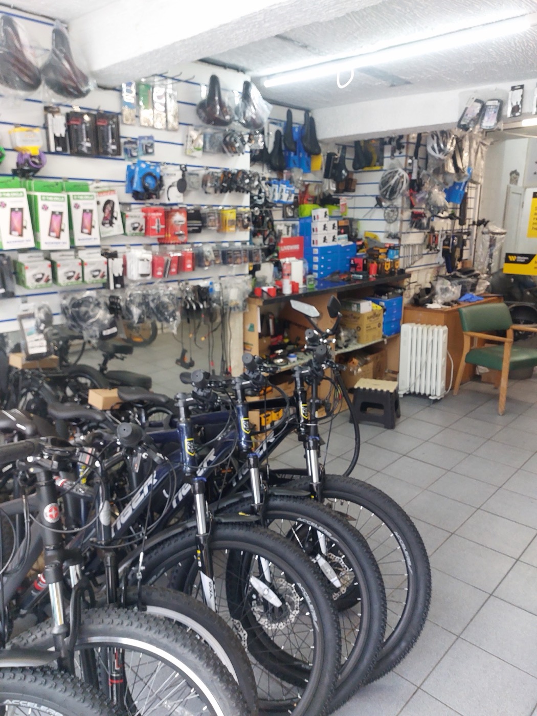 A row of mountain bikes lined up for sale inside Bethnal Green Cycles.